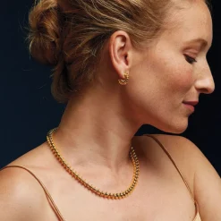 The Met Store Golden Disc Huggie Earrings